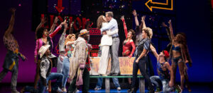 Olivia Valli and Adam Pascal, center, lead the cast of "Pretty Woman" on its national tour. (Photo by Matthew Murphy)