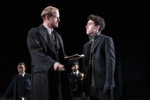 The Civilian (Corey Brill) questions young Nathan (Anthony Rosenthal) on Kristallnacht. (Photo by Joan Marcus)