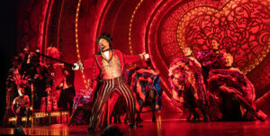 Austin Durant (Harold Zidler) with the cast of "Moulin Rouge: The Musical." (Photo by Matthew Murphy) 