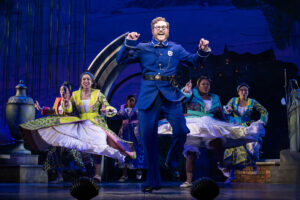Sergeant of Police (Preston Truman Boyd) responds to the delight of General Stanley's daughters. (Photo by Joan Marcus)