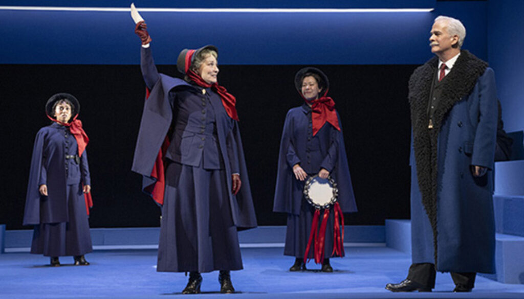 (l to r): Gabriella Sundar Singh as Barbara Undershaft, Patty Jamieson as Mrs. Baines, Lindsay Wu as Jenny Hill and Patrick Galligan as Andrew Undershaft in Major Barbara (Shaw Festival, 2025). Photo by David Cooper.